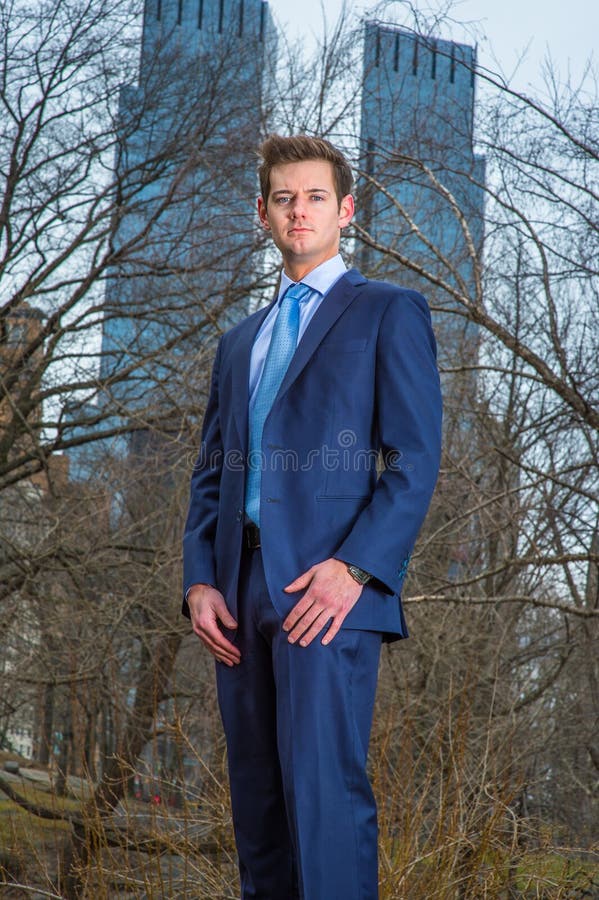 Young Man standing outdoors, looking forward royalty free stock photography