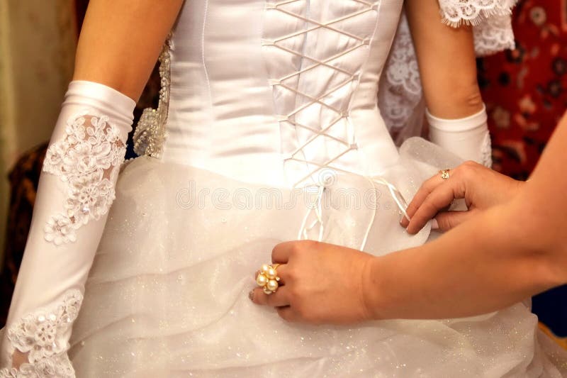 Dressing the bride stock images Dressing the bride stock images