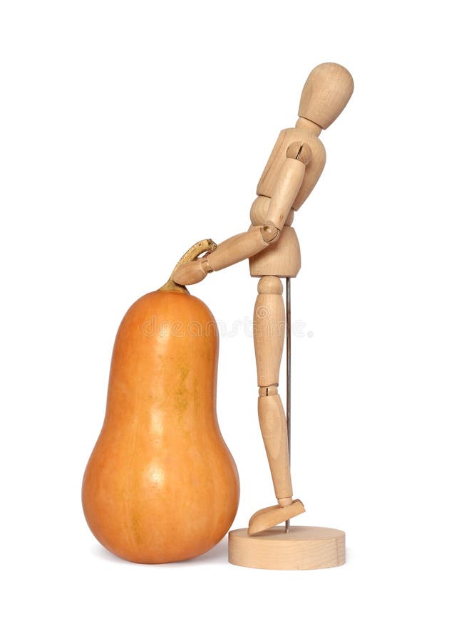 Drewniany manekin i dynia zdjęcia royalty free