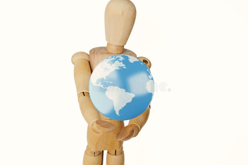 Drewniany ludzki mannequin trzyma kulę ziemską zdjęcia stock Drewniany ludzki mannequin trzyma kulę ziemską zdjęcia stock