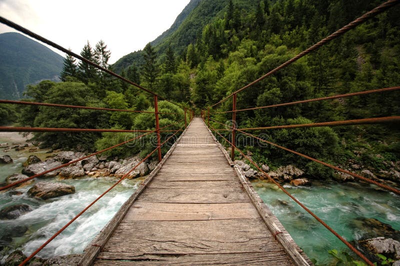 Hanging rope bridge over emerald mountain river Soca, Slovenia. Hanging rope bridge over emerald mountain river Soca, Slovenia
