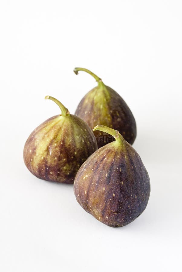 Drie fig.vruchten op een witte achtergrond royalty-vrije stock foto Drie fig.vruchten op een witte achtergrond royalty-vrije stock foto