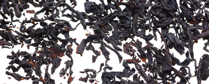 Dried Black Tea Leaves on a White Background. Stock Photo Image of