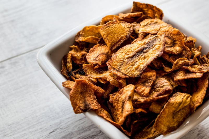 Dried Carrot Chips on White Wooden Surface. Stock Photo Image of
