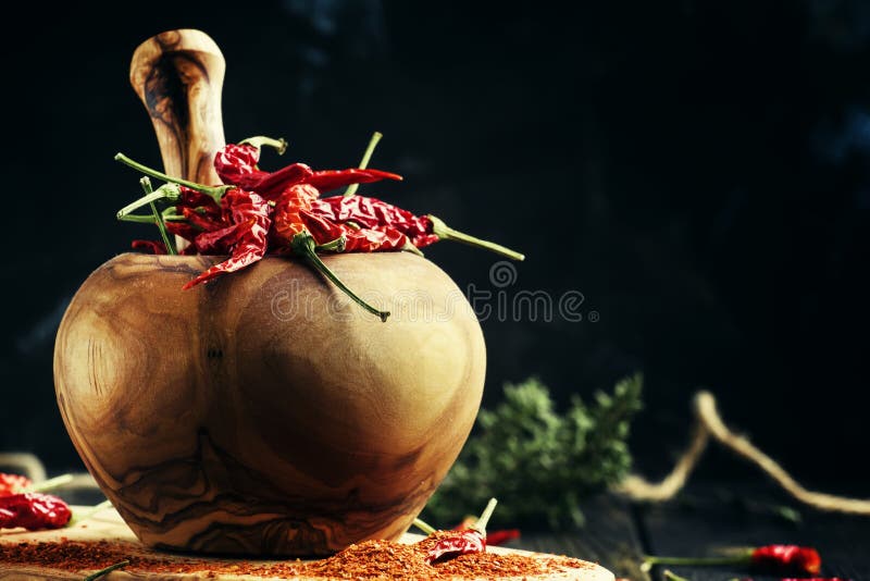 Dried chili pepper, and ground in a mortar, selective focus royalty free stock photo Dried chili pepper, and ground in a mortar, selective focus royalty free stock photo