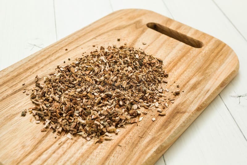 Dried chopped oak bark on a wooden board, homeopathy royalty free stock photography Dried chopped oak bark on a wooden board, homeopathy royalty free stock photography