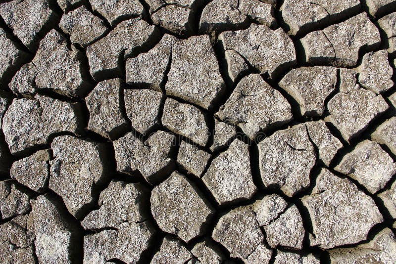 Dried cracked lake bottom background stock photos