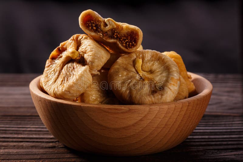 Dried figs on a dark rustic background