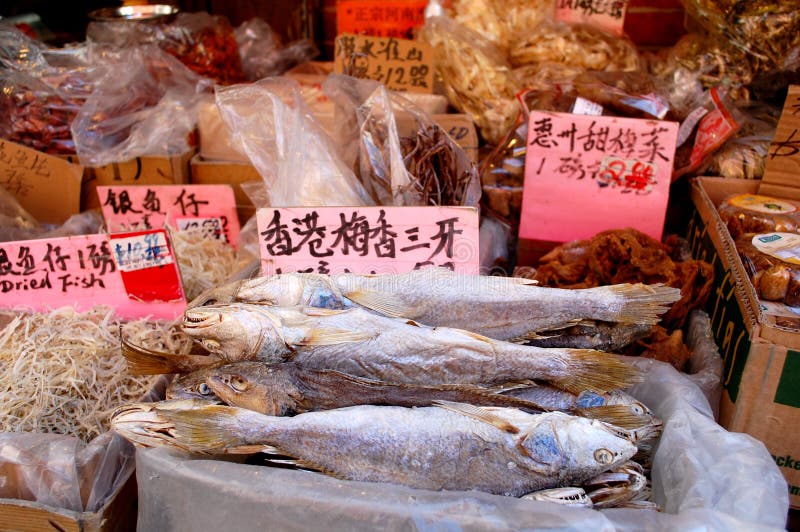 Dried fish and other exotic ingredients are sold in the Chinese market in New York City where many ethnic groups live side by side and continue their traditions. Food vendor sold stock images, royalty-free photos and pictures