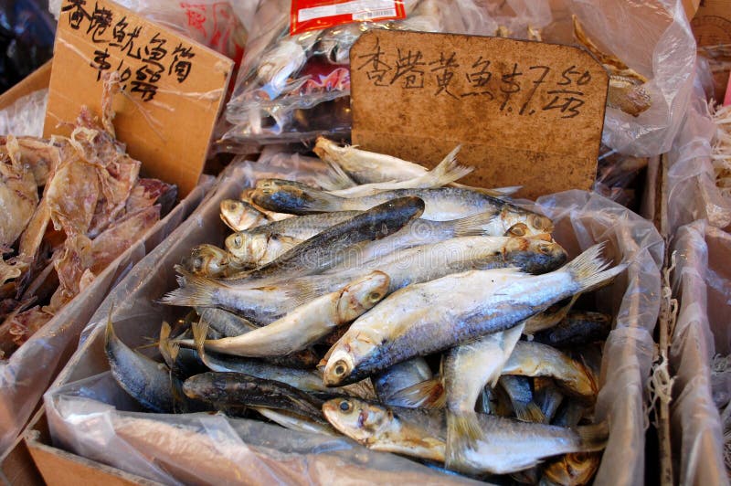 Dried fish and other exotic ingredients are sold in the Chinese market in New York City where many ethnic groups live side by side and continue their traditions. Food vendor sold stock images, royalty-free photos and pictures