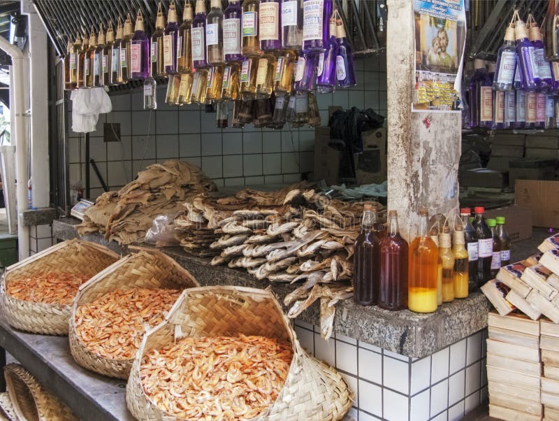 Dried fish and spirits at the market stock photos