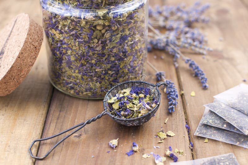 Dried flowers of lavender and mallow on a wooden background. Natural health. Aromatherapy. Free space for text. Copy space.