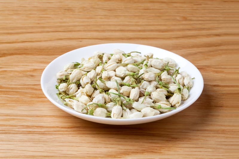 Dried jasmine flowers tea stock image. Image of wood 144869887