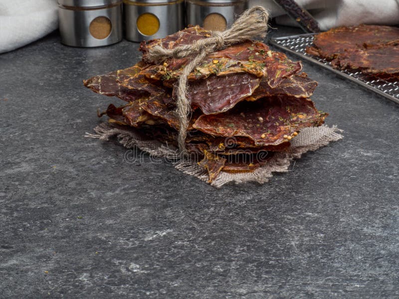 Dried Meat Slices with Spices in Jars, Copy Space Stock Photo Image