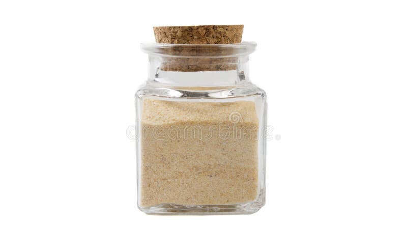 Dried milled ground garlic in glass  jar on isolated on white background. front view. spices and food ingredients