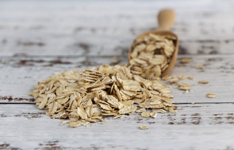 Dried Oats or Oatmeal in Spoon on the Wood Table. Its are a Nutrient ...