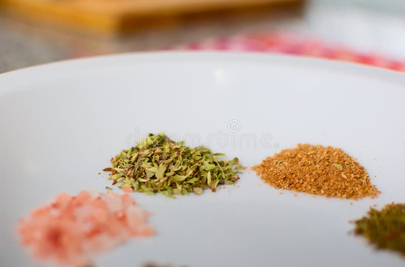 Dried Oregano and Cumin on a Dish. Extreme Close Up Stock Photo Image