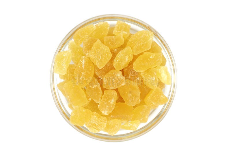 Dried pineapple slices in a glass dish royalty free stock photography
