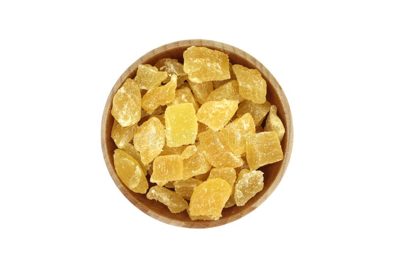 Dried pineapple slices in a wooden bowl royalty free stock photography