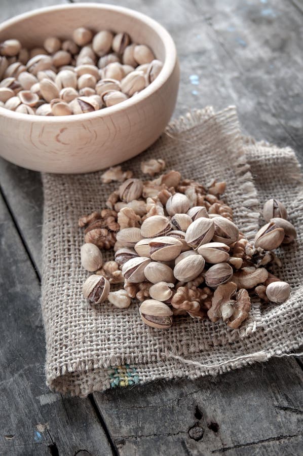 Dried Pistachio Nuts In A Wooden Bowl