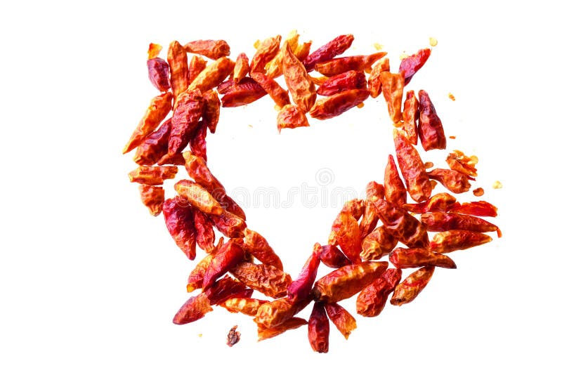 Dried red chili peppers in a heart shape isolated on a white background, love concept and heart health