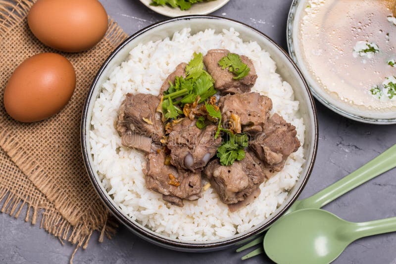 Dried Rice Porridge with Boiled Pork Bones and Broth Stock Photo
