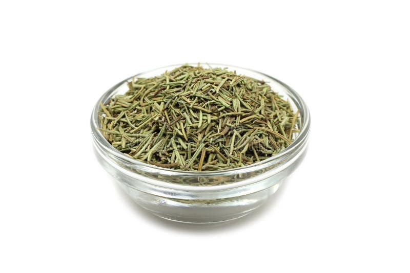 Dried rosemary in a glass cup stock photo