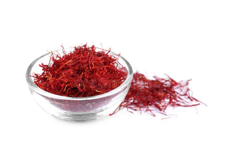 Dried saffron and glass bowl on white background stock photo