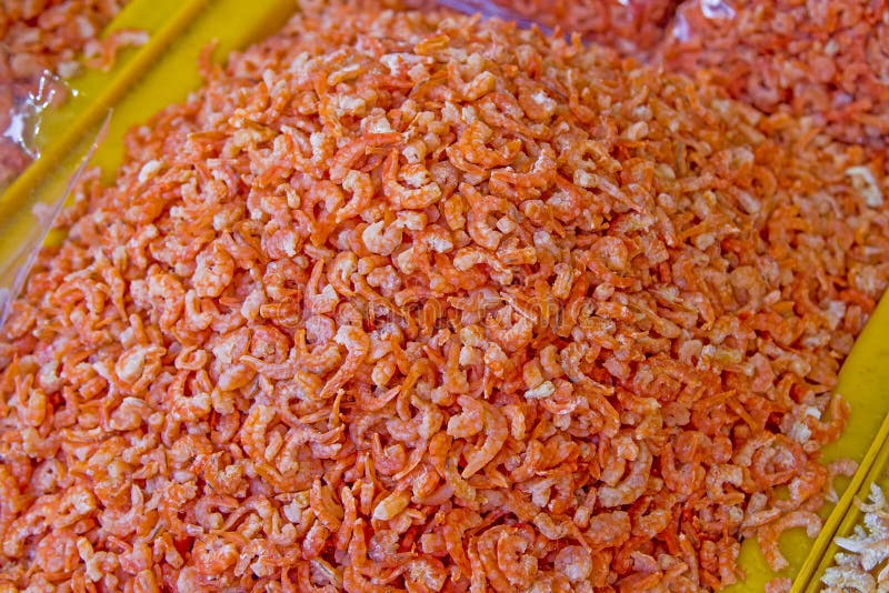 Dried shrimps of fresh orange is in the yellow royalty free stock images