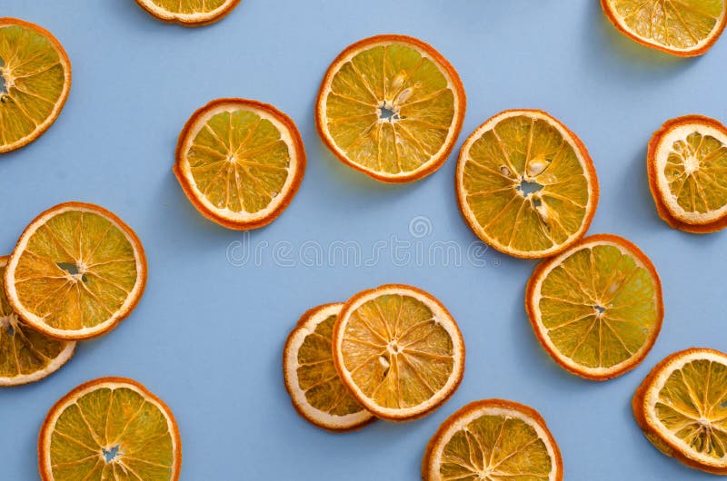 Dried slices oranges citrus fruit on light blue background. Homemade natural aroma decor. Concept of holiday. Marry Christmas. stock images Dried slices oranges citrus fruit on light blue background. Homemade natural aroma decor. Concept of holiday. Marry Christmas. stock images