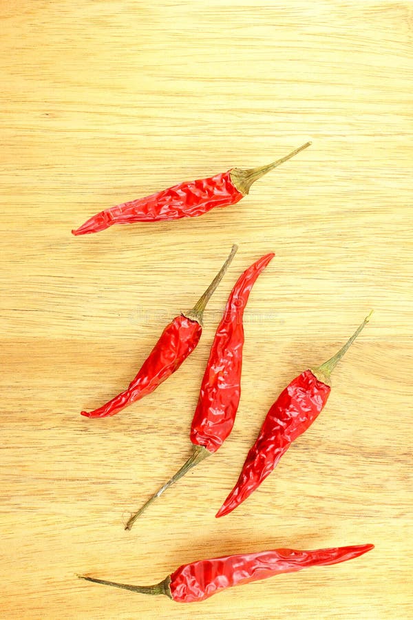 Dried Thai Chili Peppers on a Wooden Board with Copyspace Stock Image