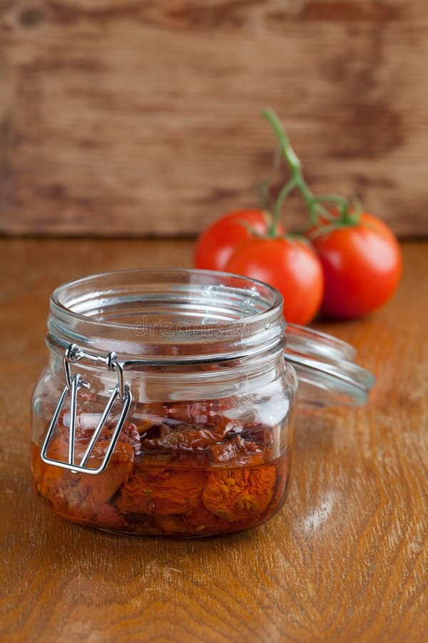 Dried tomatoes in a jar stock photo. Image of snack, ingredient 35293620