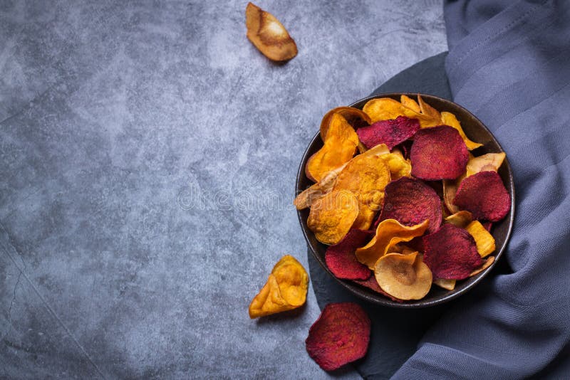 Dried vegetables, dehydrated sweet potato, parsnip, beetroot chips, snacks royalty free stock images