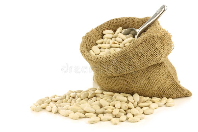 Dried white beans in a burlap bag stock photos