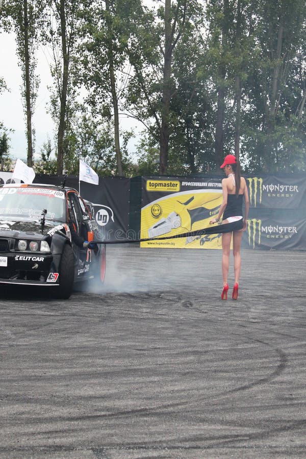 Drifting car and girl editorial photo. Image of championship - 86121811