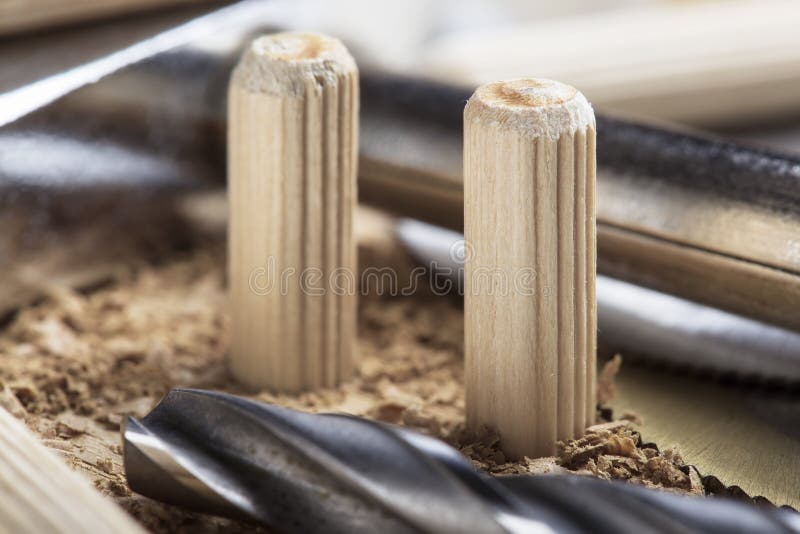 Drill Bit Makes Hole in Wooden Oak Board for Wooden Dowel Stock Image