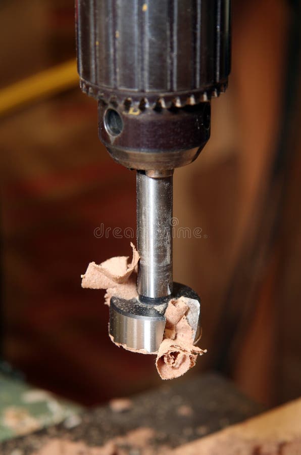 Drill press with a forstner bit attached