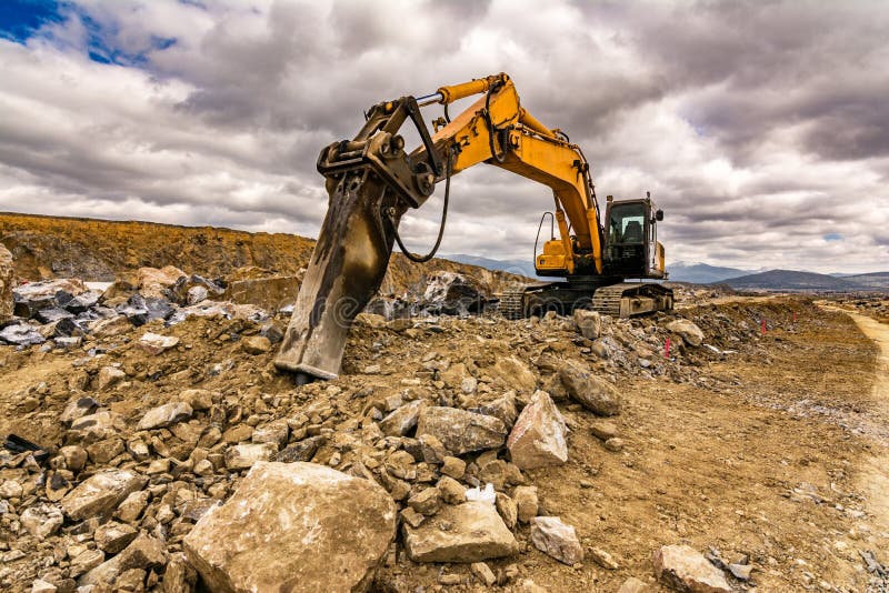 Drilling excavator machine building a road royalty free stock images