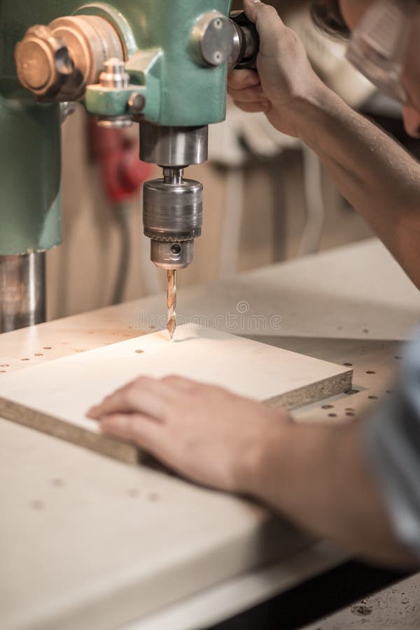 Drilling a hole in wood stock photo. Image of manipulate 59954580