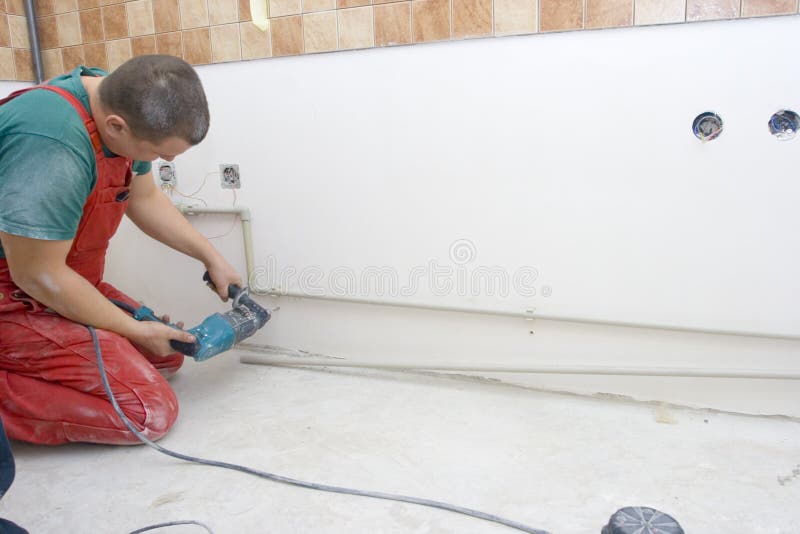 Drilling Holes for the Fixing Water Pipes Stock Photo Image of