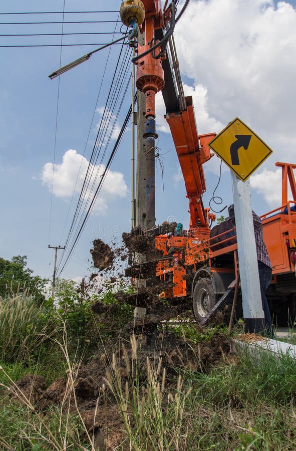 Drilling holes in ground stock image. Image of industry 52273935