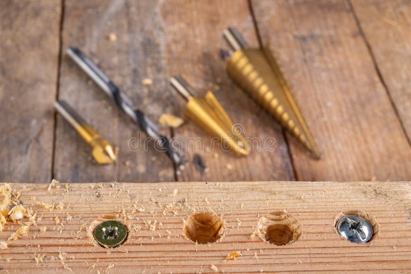 Drilling A Hole In Wood. Wood Drill And Plywood In A Carpentry