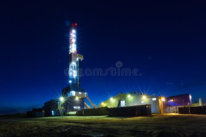 Drilling rig in oil field for drilled into subsurface stock photos