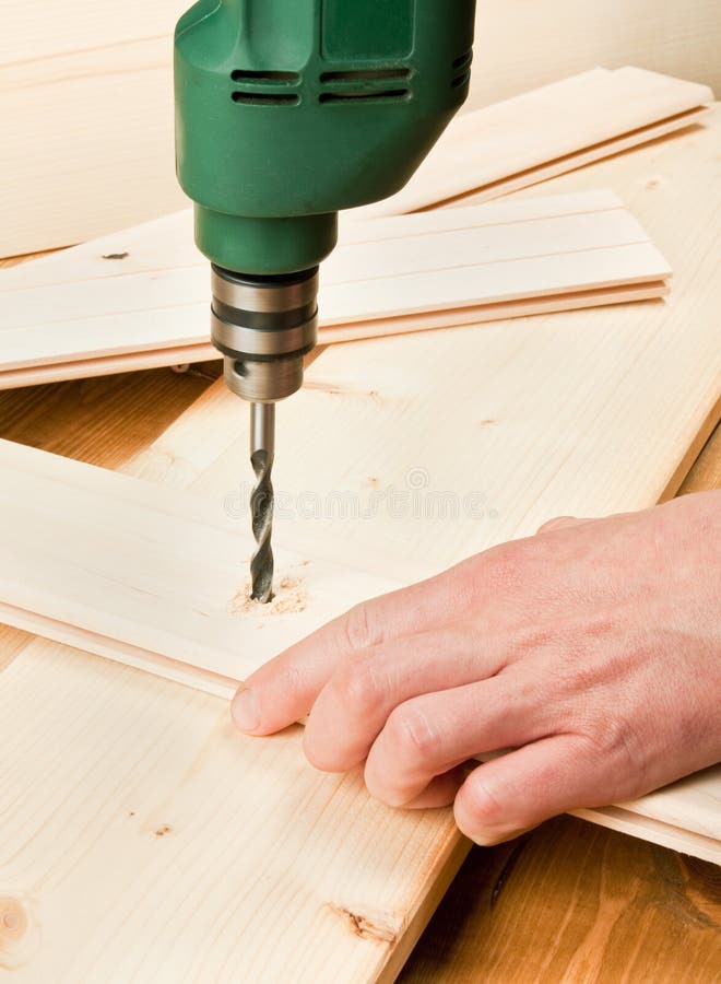 Drilling wood stock image. Image of handyman, instrument 22442003