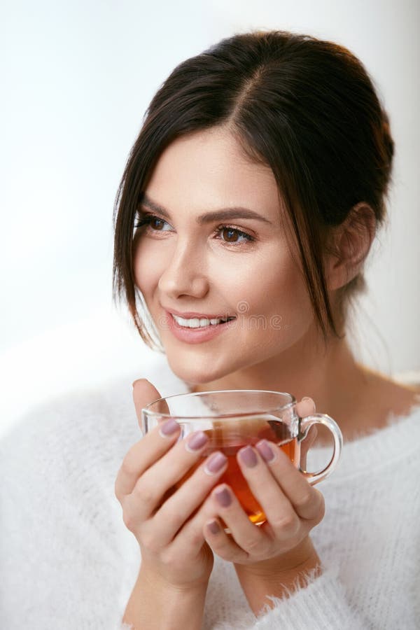 Drink. Beautiful Woman Drinking Tea From Cup