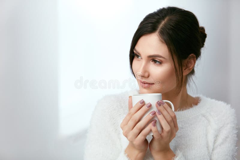 Drink. Beautiful Woman Drinking Tea From Cup