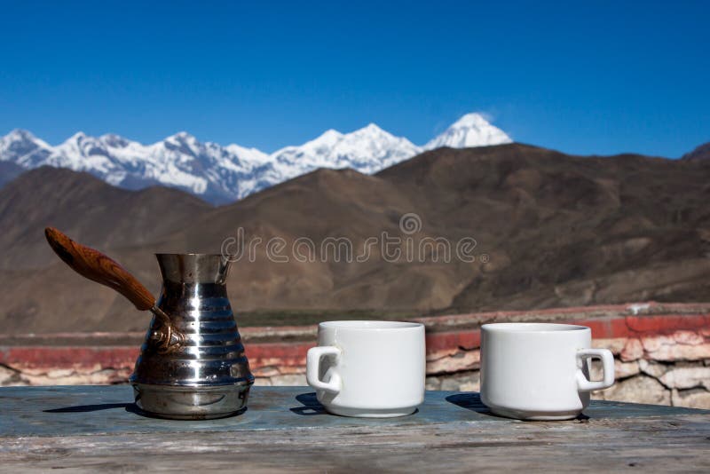 Drinking coffee with stunning mountain view. royalty free stock image Drinking coffee with stunning mountain view. royalty free stock image