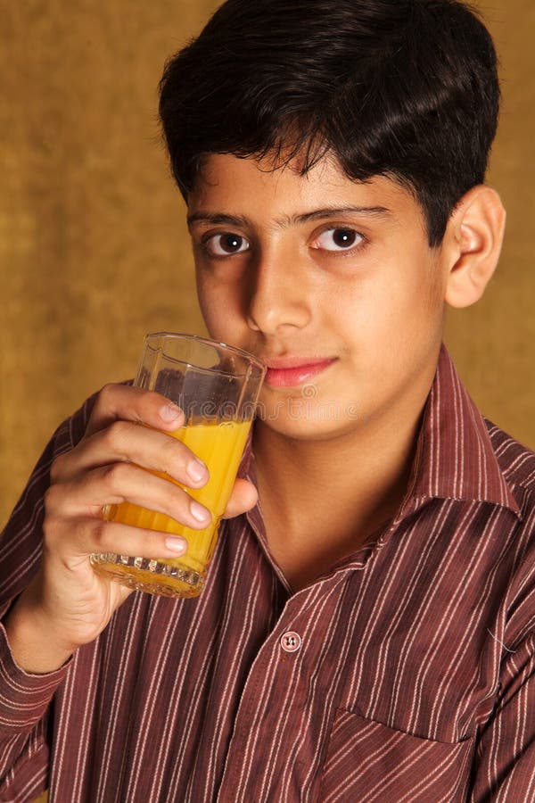 Drinking orange juice stock image. Image of person, length 16791023