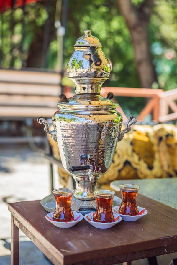 Drinking Traditional Turkish Tea with Turkish Tea Cup and Copper Tea