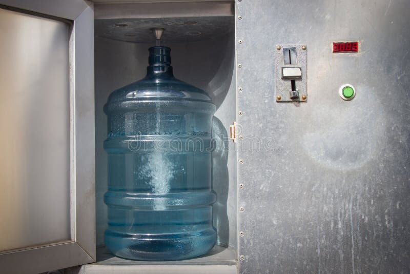 Drinking Water Dispenser. Drinking Water Vending Machine Coin. Stock
